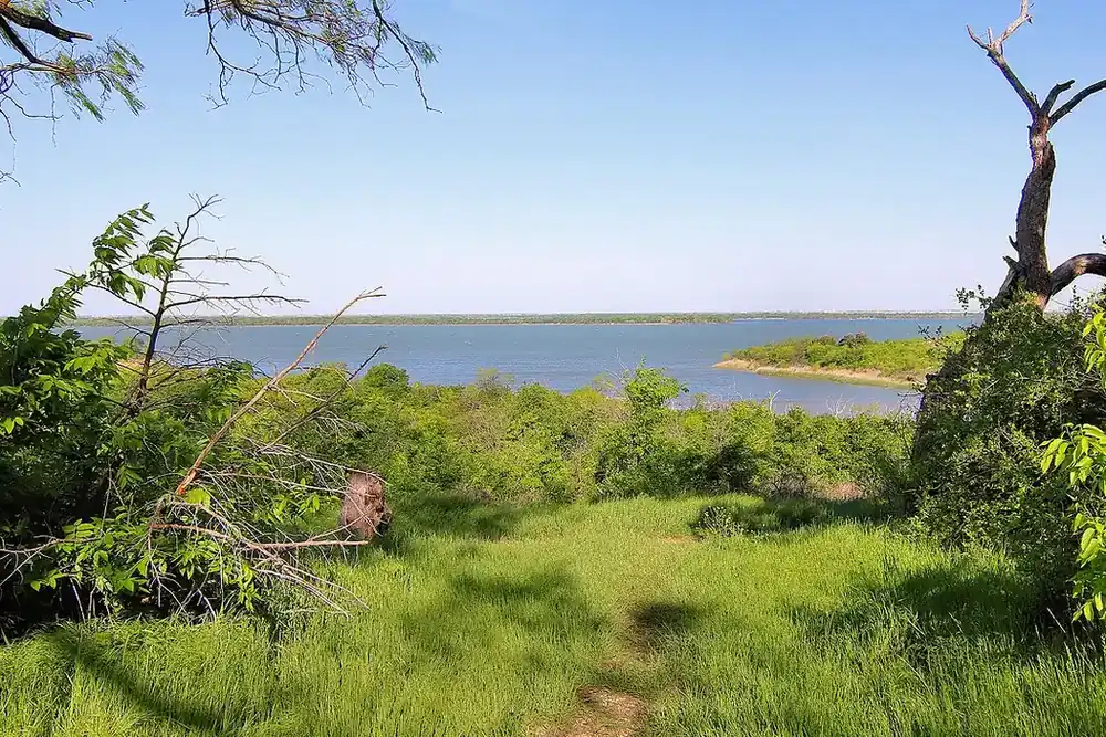 Joe Pool Lake seen from a grassy overlook in Cedar Hill State Park in Cedar Hill, Texas